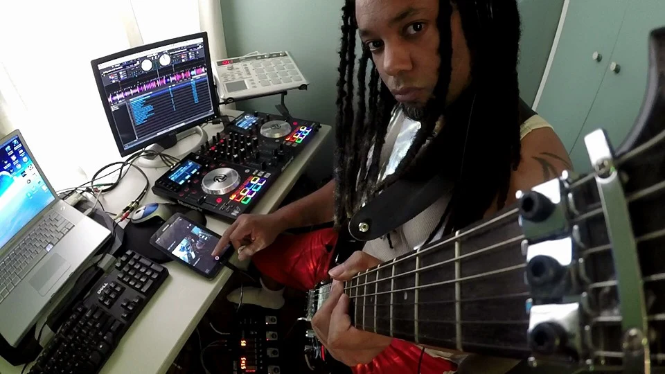 Nappy Soldier playing bass in the studio