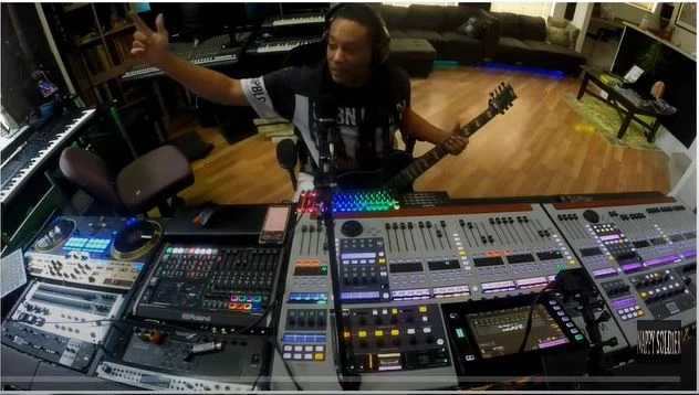 Nappy Soldier in the recording studio with guitar